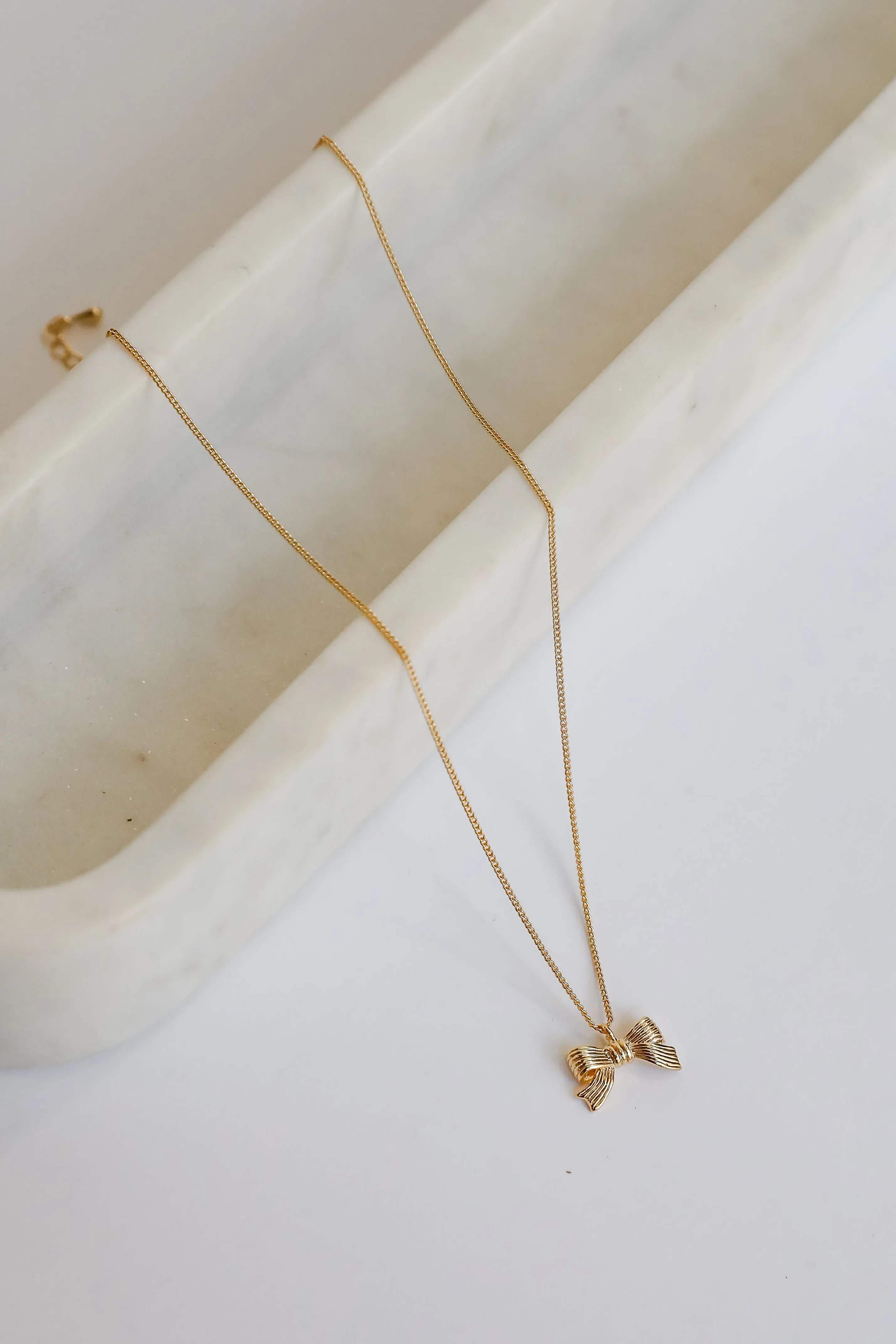 Gemma Gold Bow Charm Necklace